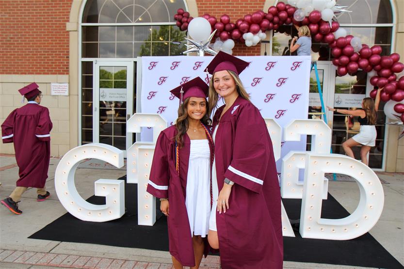 Graduates wearing maroon robes